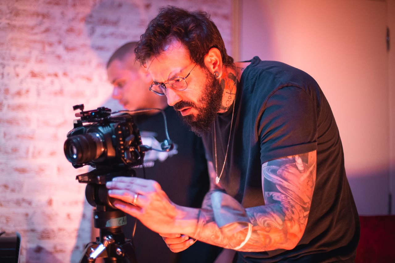 Behind the camera.